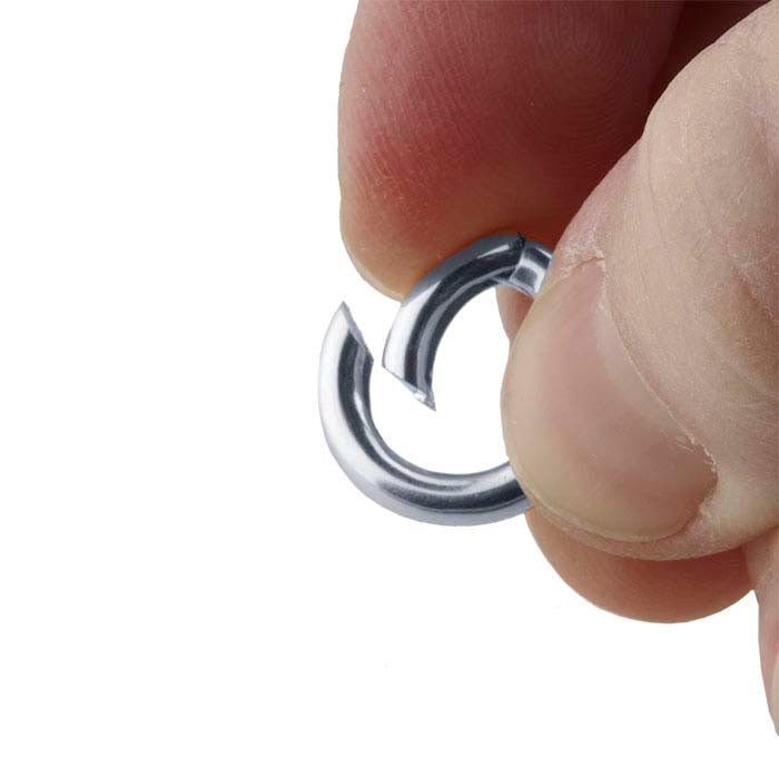 The ring that opens to accept the pendant - Evitts Creek Arts
